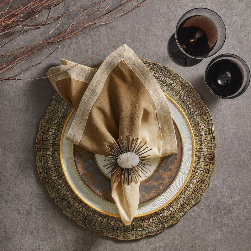 Flare napkin ring in black by Kim Seybert styled with brown ombre napkin.