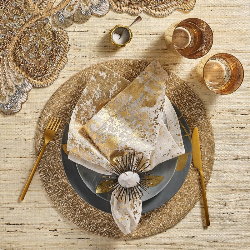 Flare napkin ring in black by Kim Seybert styled with gold beaded placemat.