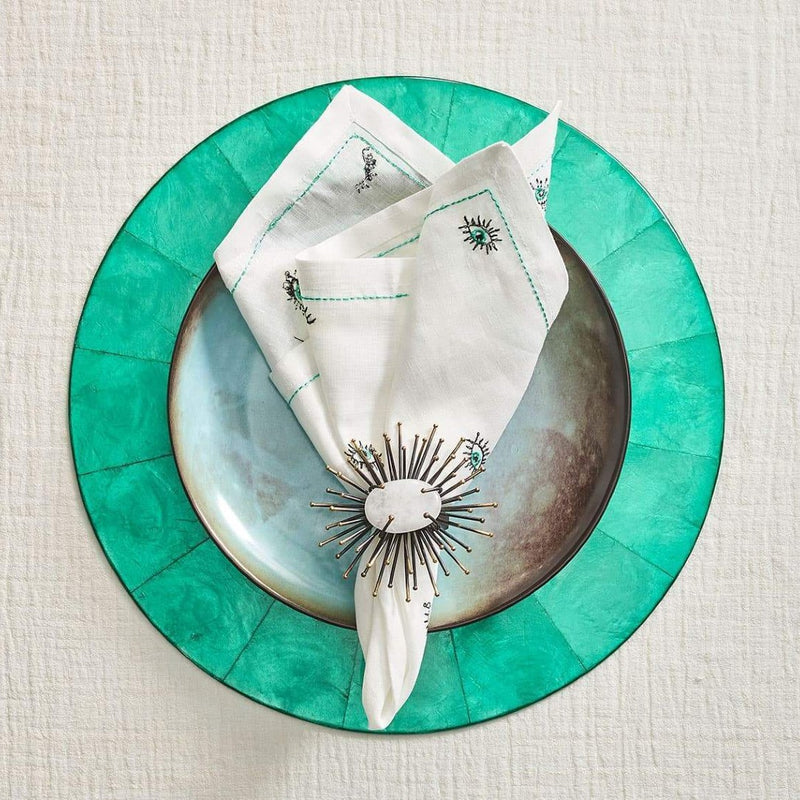 Amiramour luxury flare napkin ring in black by Kim Seybert is styled with a turquoise Capiz placemat.
