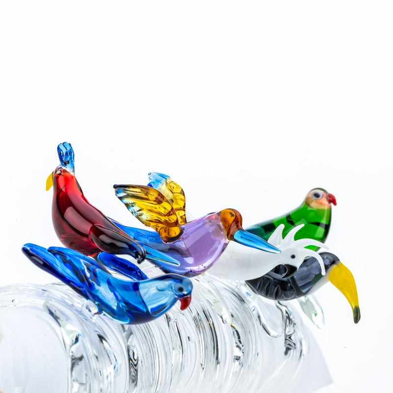 Set of six tropical bird napkin rings by Casa Rialto shown on white background.