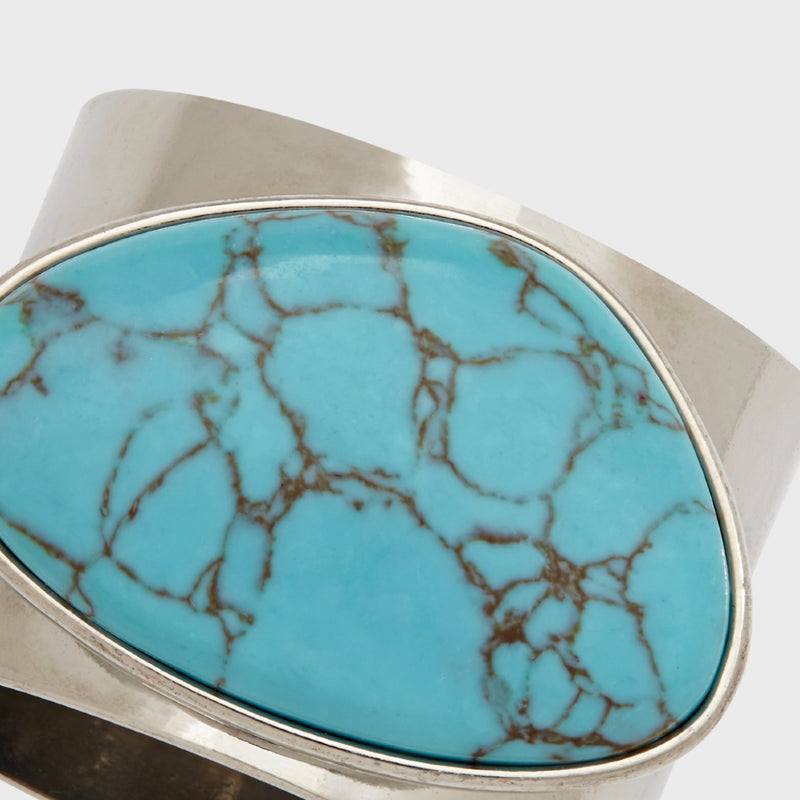 Close-up of turquoise gilt edge shell napkin ring by Joanna Buchanan