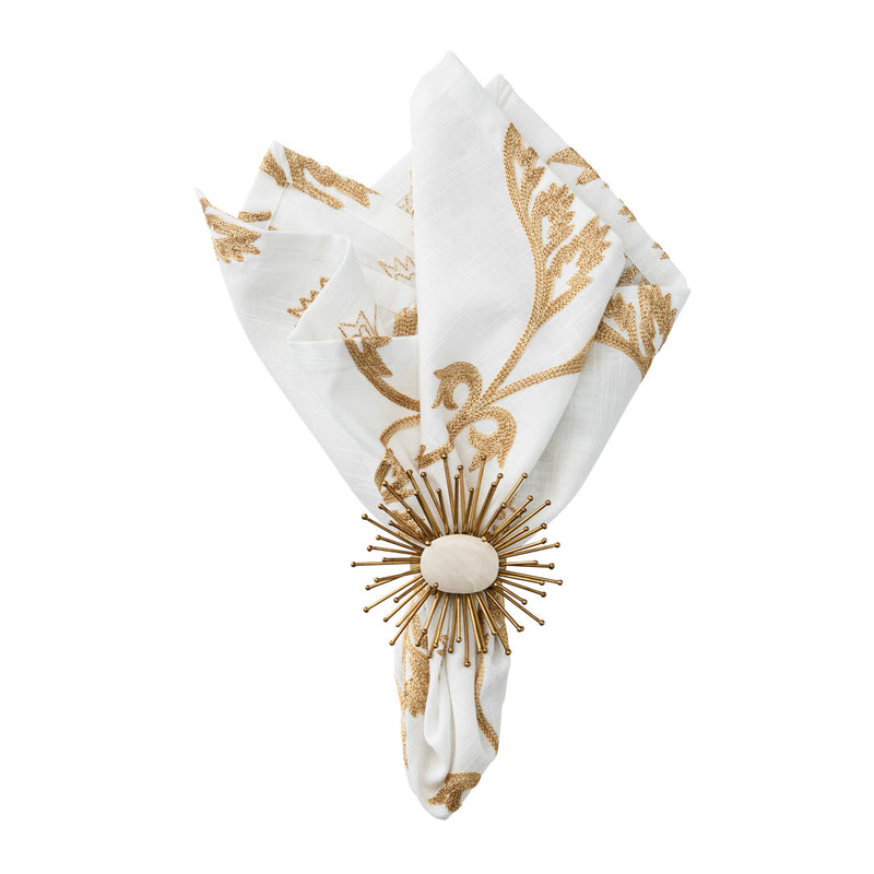 Flare Napkin Ring in gold by Kim Seybert styled on white napkin, sold by Amiramour