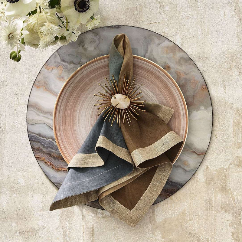 Gray and taupe table setting with marble accents and gold Flare Napkin Ring by Kim Seybert