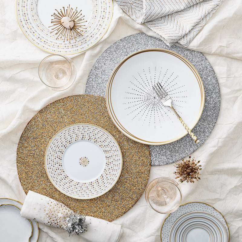 Mixed metallics table décor with silver and gold accents including Starburst napkin rings by Kim Seybert