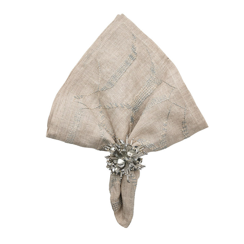 Metallic silver Starburst napkin ring on nude napkin, elegant contrast, offered by Amiramour