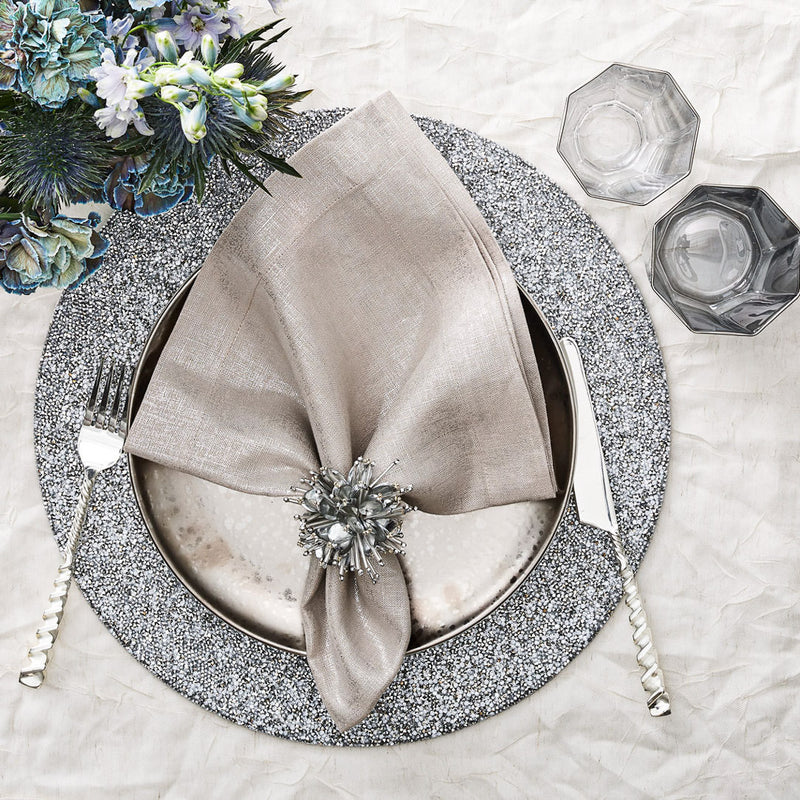 Glam silver tablescape with shimmering Starburst napkin rings by Kim Seybert from Amiramour