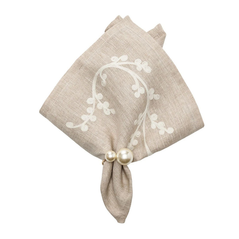 Elegant pearl napkin ring in ivory and gold, styled on napkin, sold by Amiramour