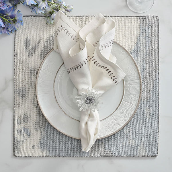 Overhead shot of dining setup with Bloom napkin ring available on Amiramour