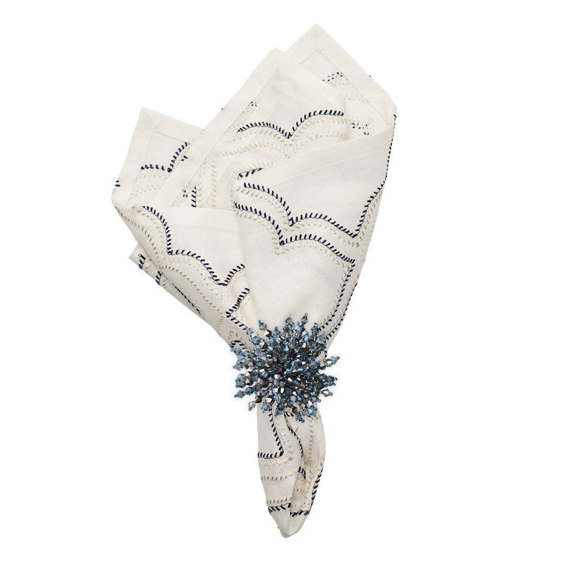 Brilliant Napkin Ring by Kim Seybert on white napkin with navy accents 