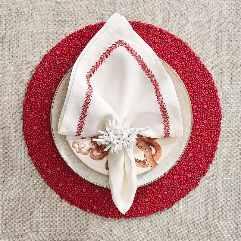 Vibrant red table décor featuring Amalfi napkin ring by Kim Seybert