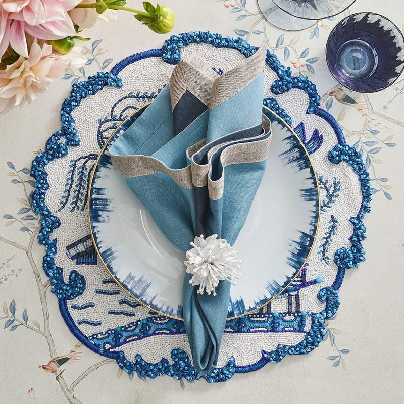 Sophisticated navy and white table décor showcasing Starburst napkin rings by Kim Seybert