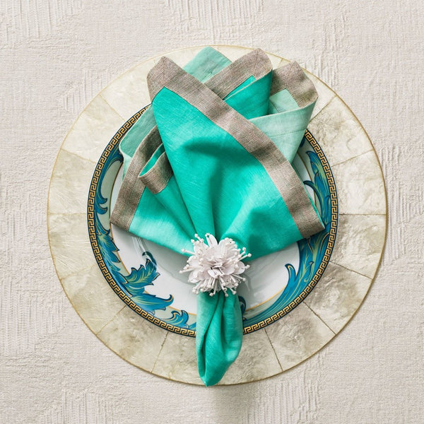 Vibrant turquoise tablescape featuring Starburst beaded napkin ring, ocean-inspired elegance