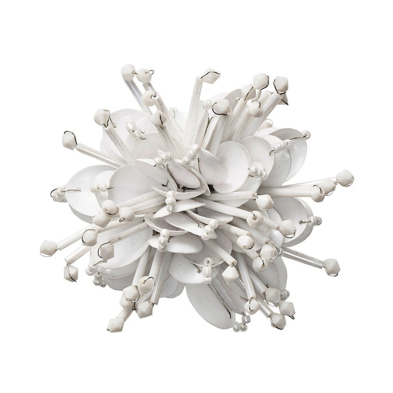  Top view of white Starburst napkin ring, shimmering beaded burst pattern by Kim Seybert