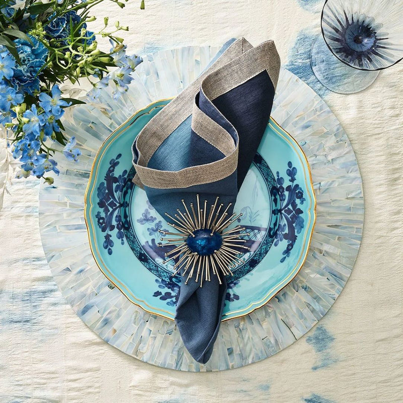 Dark blue spring table setting with Flare Napkin Ring by Kim Seybert
