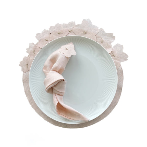 Light pink linen placemat with 3D cherry blossom appliqué with matching napkin.