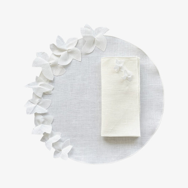 White linen placemat with 3D jasmine flower by Giardino Segreto with matching napkin.
