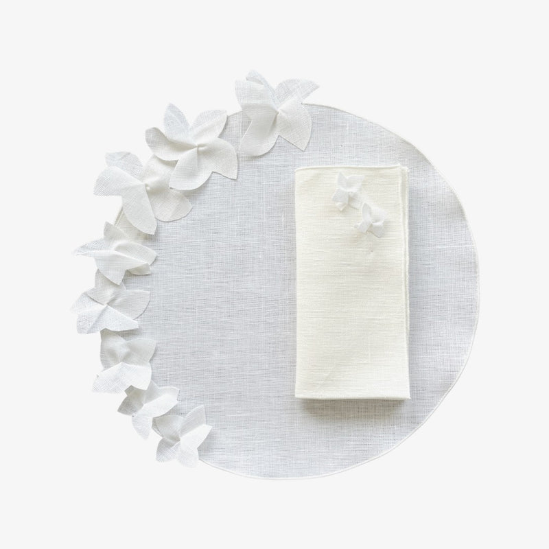 White linen placemat with 3D jasmine flower by Giardino Segreto with matching napkin.