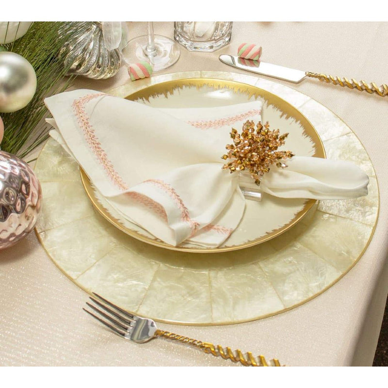 Natural Capiz shell round placemat with pearlescent finish by Kim Seybert side view.