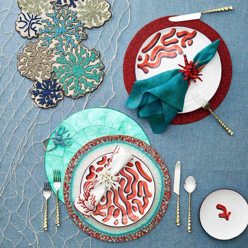Amalfi beaded placemat with turquoise and coral beadwork with other coastal tale accessories.