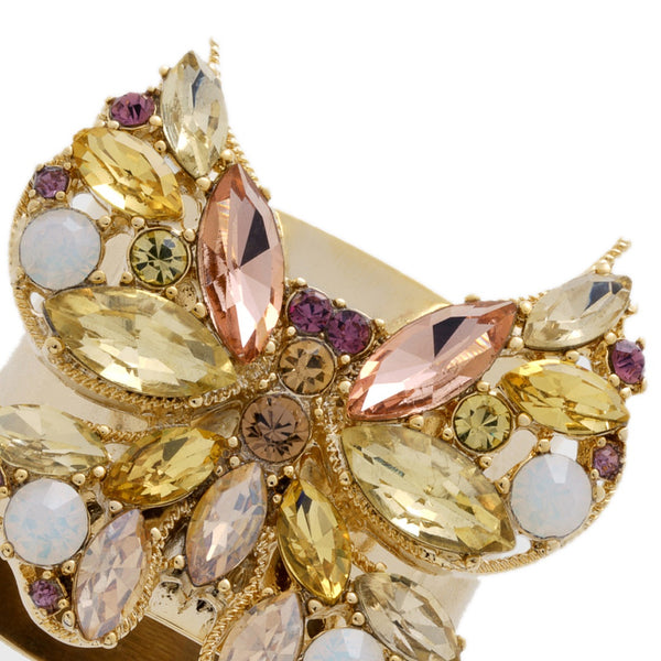 Close-up of pastel crystal details on butterfly napkin ring in yellow by Joanna Buchanan, available at Amiramour