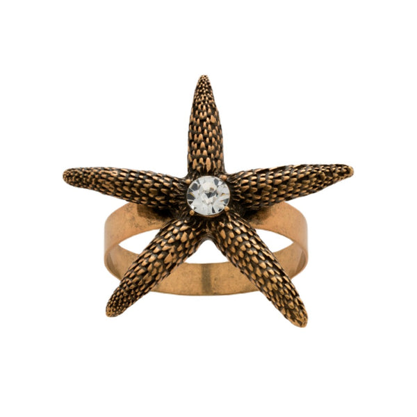 Starfish napkin ring in bronze by Joanna Buchanan, on white background.
