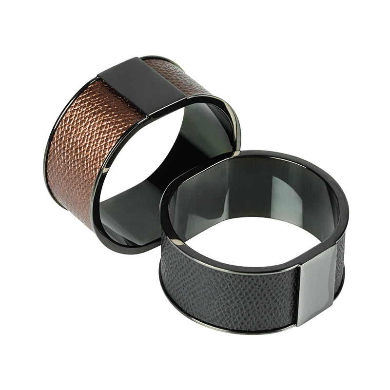 Lux Plus napkin rings by Giobagnara, in black and brown leather with a palladium finish.