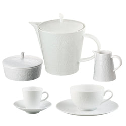 A set of Minéral White porcelain tea and coffee set of 15 by Raynaud, with teapot, cups, and saucers including cups, saucers, a teapot, a sugar bowl, and a milk jug, displayed against a white background.