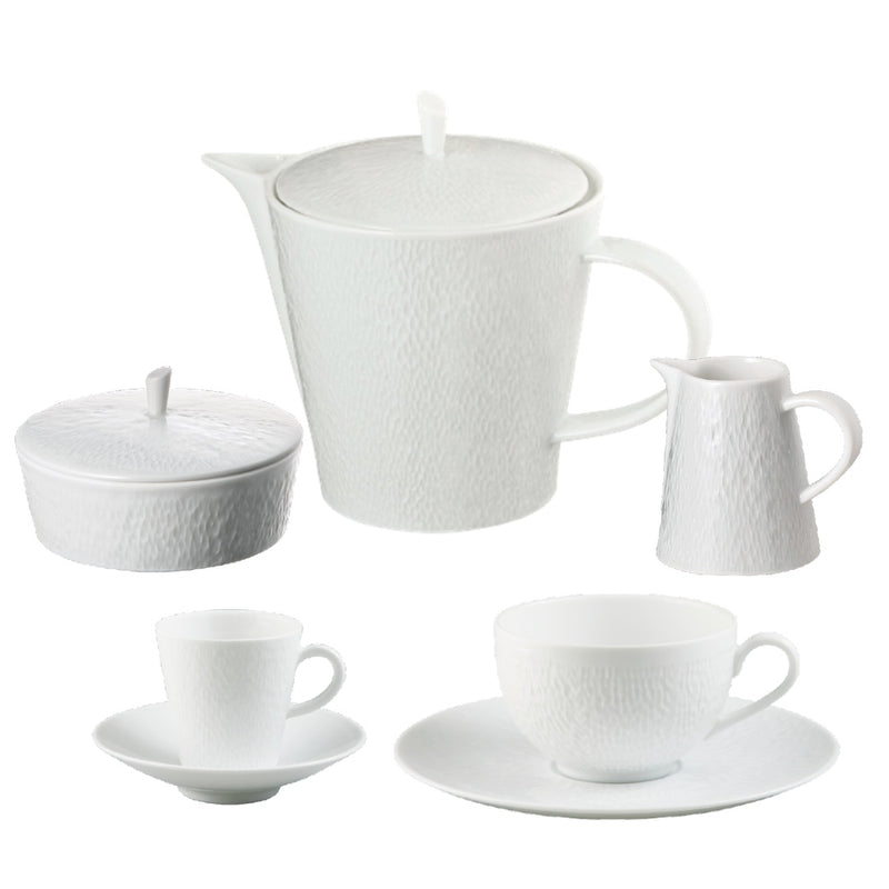 A set of Minéral White porcelain tea and coffee set of 15 by Raynaud, with teapot, cups, and saucers including cups, saucers, a teapot, a sugar bowl, and a milk jug, displayed against a white background.