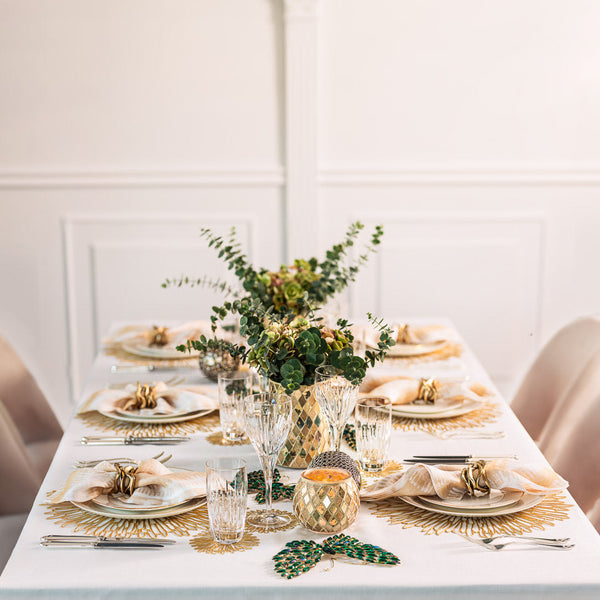 Luxury garden-inspired table setting from The Butterfly Effect by Amiramour with green butterfly decorations and golden mosaic vases.