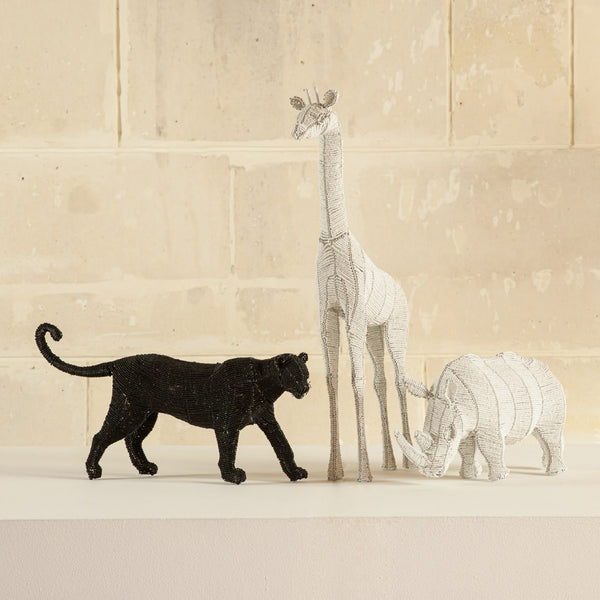 handmade beads figurines of black chettah, a hippo and giraffe with a cream background