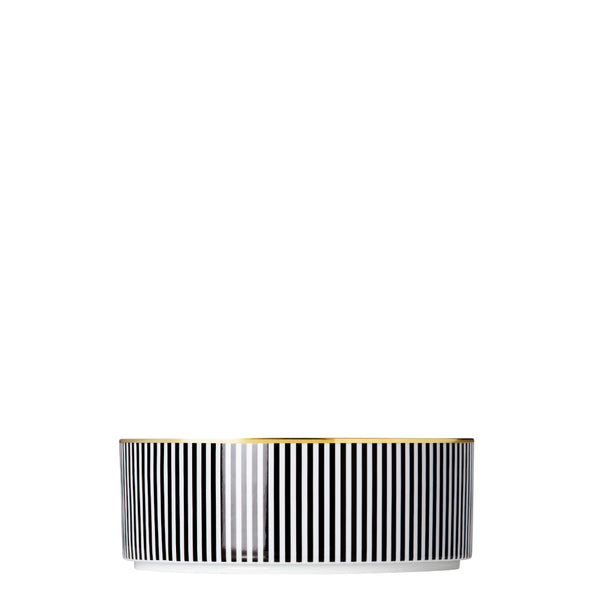 A porcelain large cylindrical bowl from my china ca d oro collection with black and white vertical stripes and gold rim by sieger furstenberg