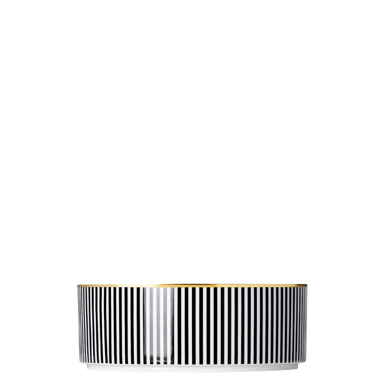 A porcelain large cylindrical bowl from my china ca d oro collection with black and white vertical stripes and gold rim by sieger furstenberg