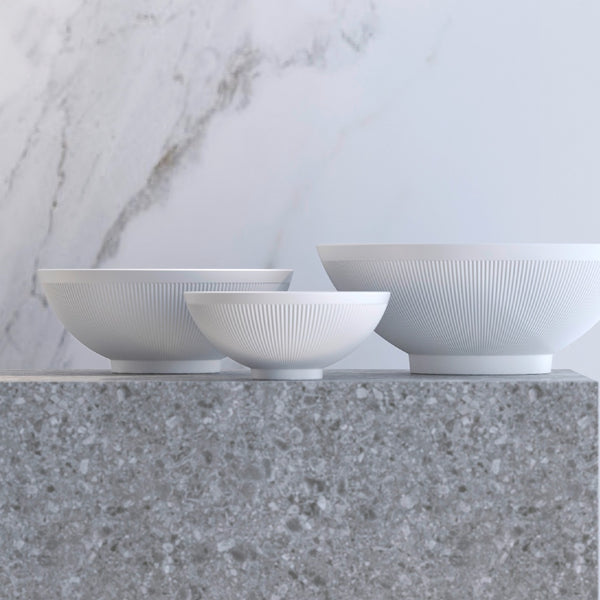 styled Stella Satin White velvety matte porcelain bowls by SIEGER by FÜRSTENBERG, handcrafted in Germany for elegant dining.

