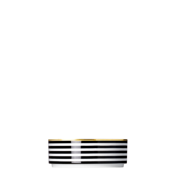 A porcelain medium cylindrical bowl from my china ca d oro collection with black and white horizontal stripes and gold rim by sieger furstenberg