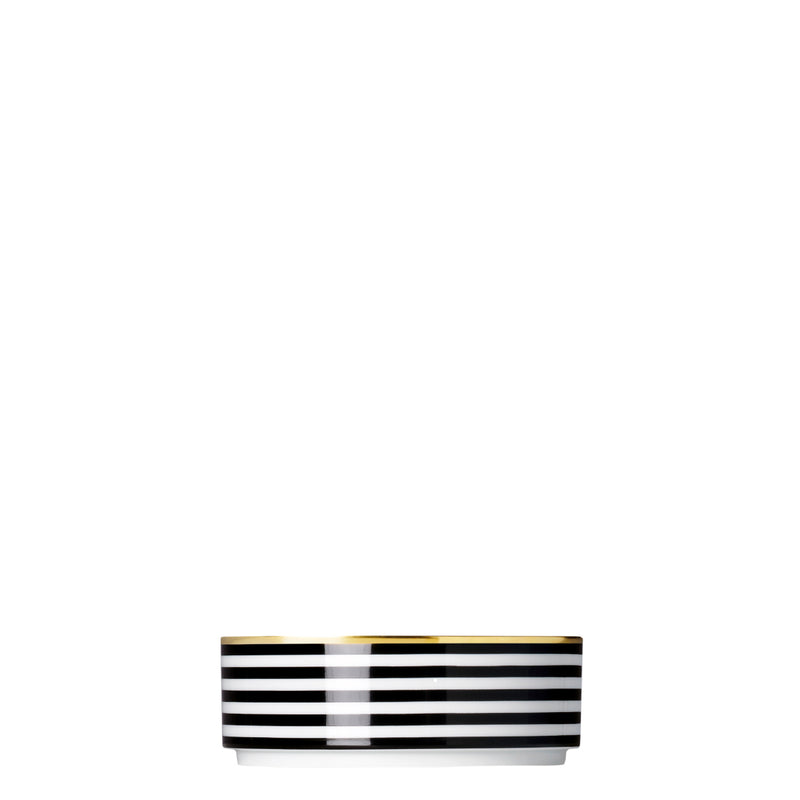 A porcelain medium cylindrical bowl from my china ca d oro collection with black and white horizontal stripes and gold rim by sieger furstenberg
