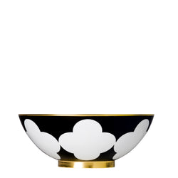 A white and gold porcelain bowl with a black geometric pattern and gold rim.