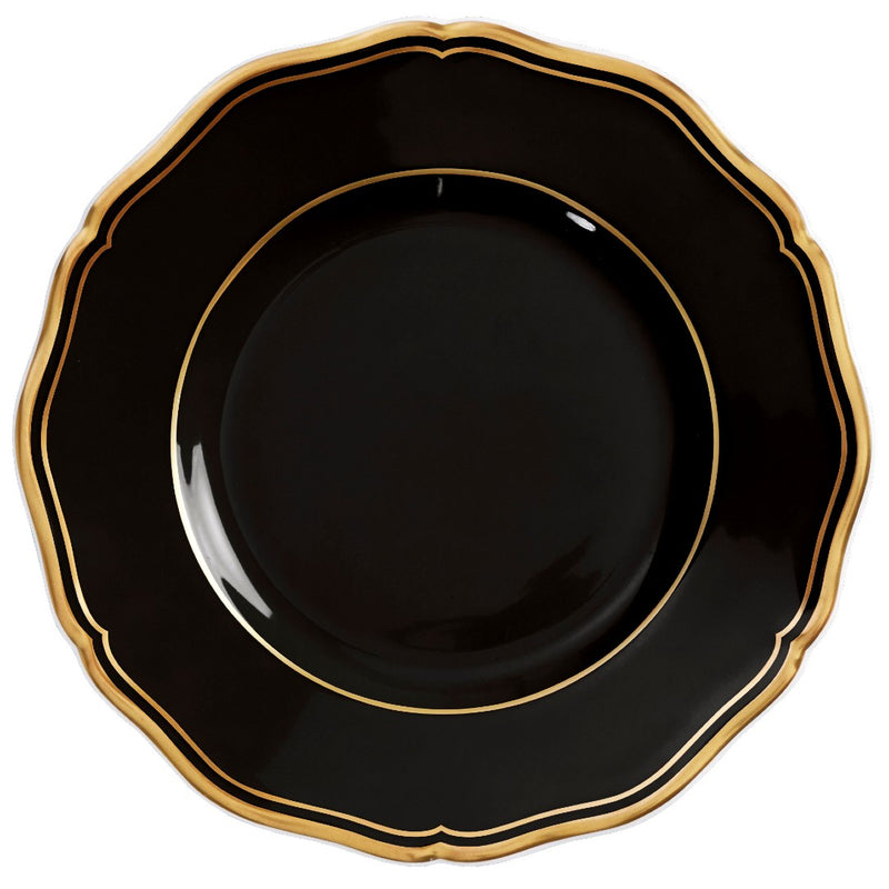 A porcelain bread and butter plate with scalloped edge black finish and gold rim from mazurka gold and black by raynaud