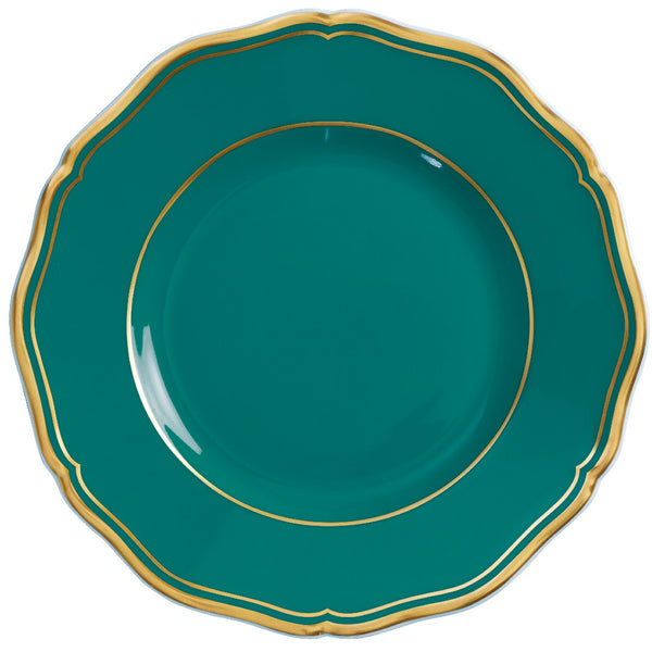 A round, turquoise and gold porcelain bread and butter plate with scalloped edges and gilded contour.