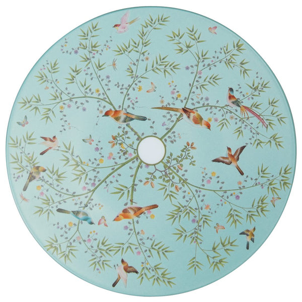 A turquoise porcelain dessert plate with a floral motif and small birds designed by Raynaud.