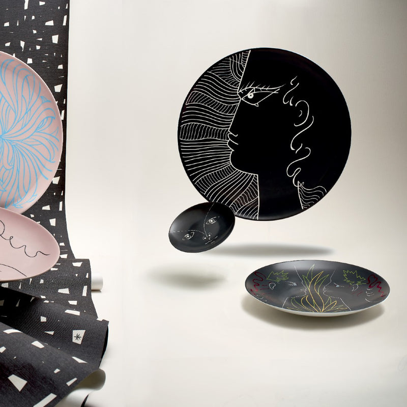Styled setting with Bread plate black with child’s face design Jean Cocteau collection Raynaud 