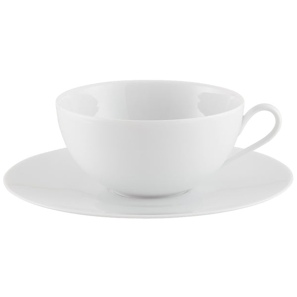 A white porcelain cup with a saucer from the "Uni" Collection by Raynaud.
