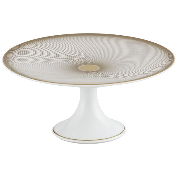 A white, gold, and brown Raynaud porcelain cake stand with a geometric pattern.