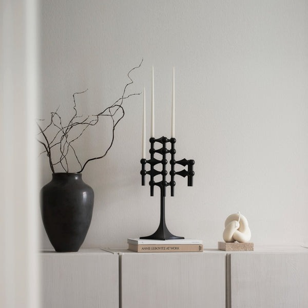 styled counter with black vase and Matte black candle stand by Stoff Nagel