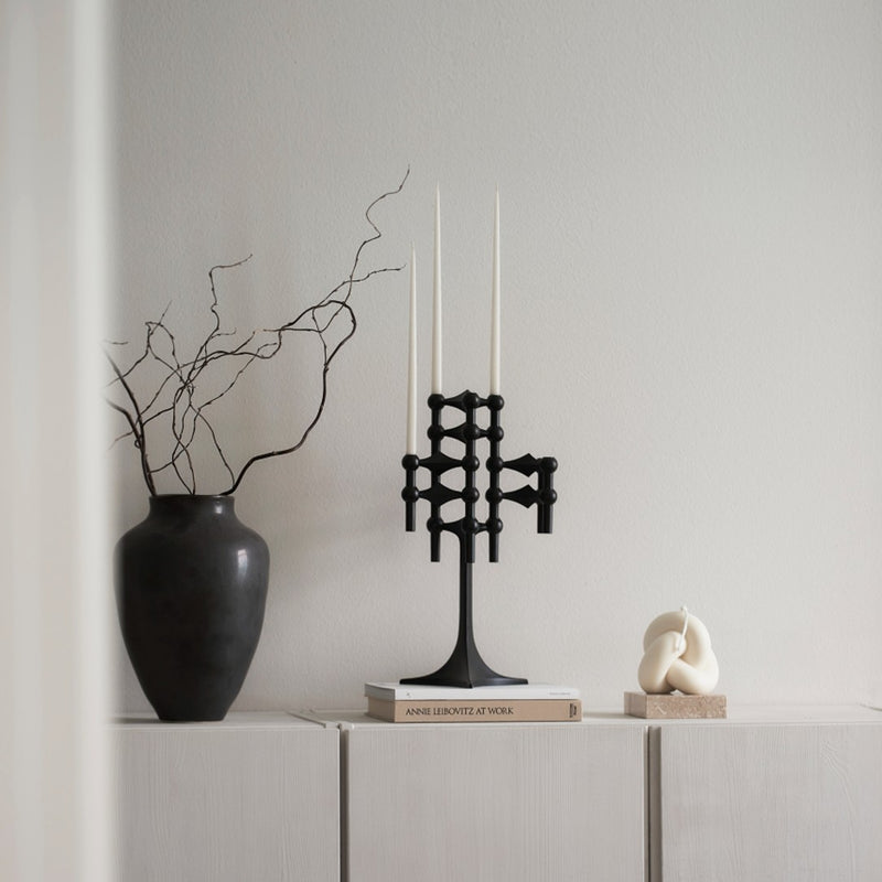 styled counter with black vase and Matte black candle stand by Stoff Nagel