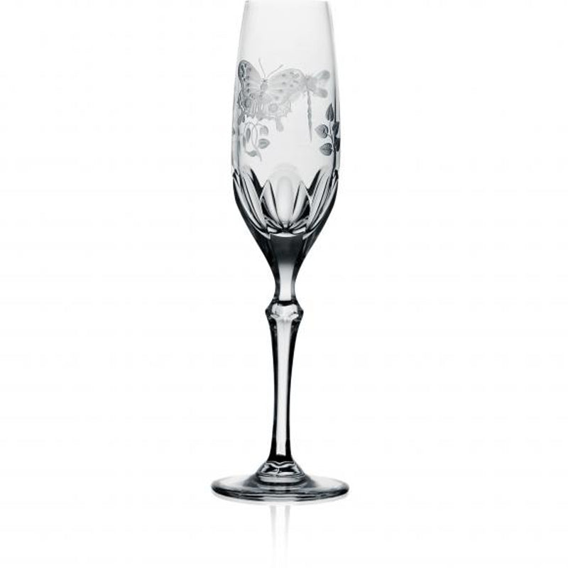 A clear champagne flute with hand-engraved springtime creatures and a flat cut base, made from hand-cut, hand-engraved art crystal.