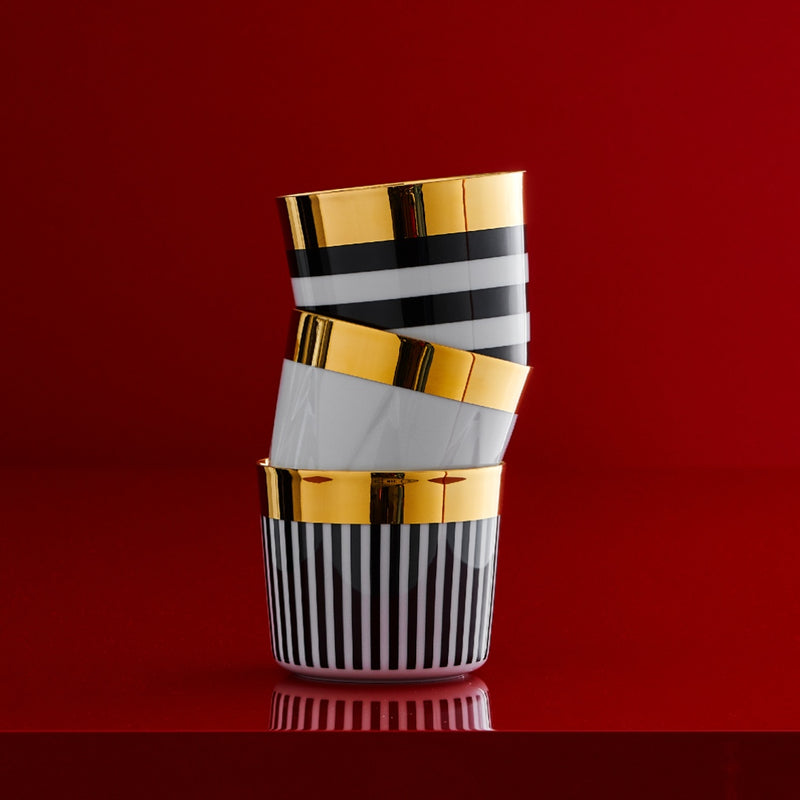Stacked porcelain champagne goblet sip of gold from my china ca d oro collection on a red background