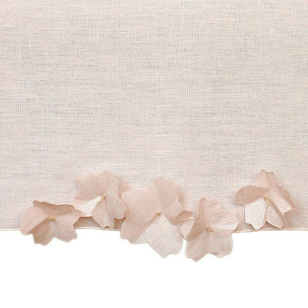 close-up of added linen flowers in ight pink to a runner