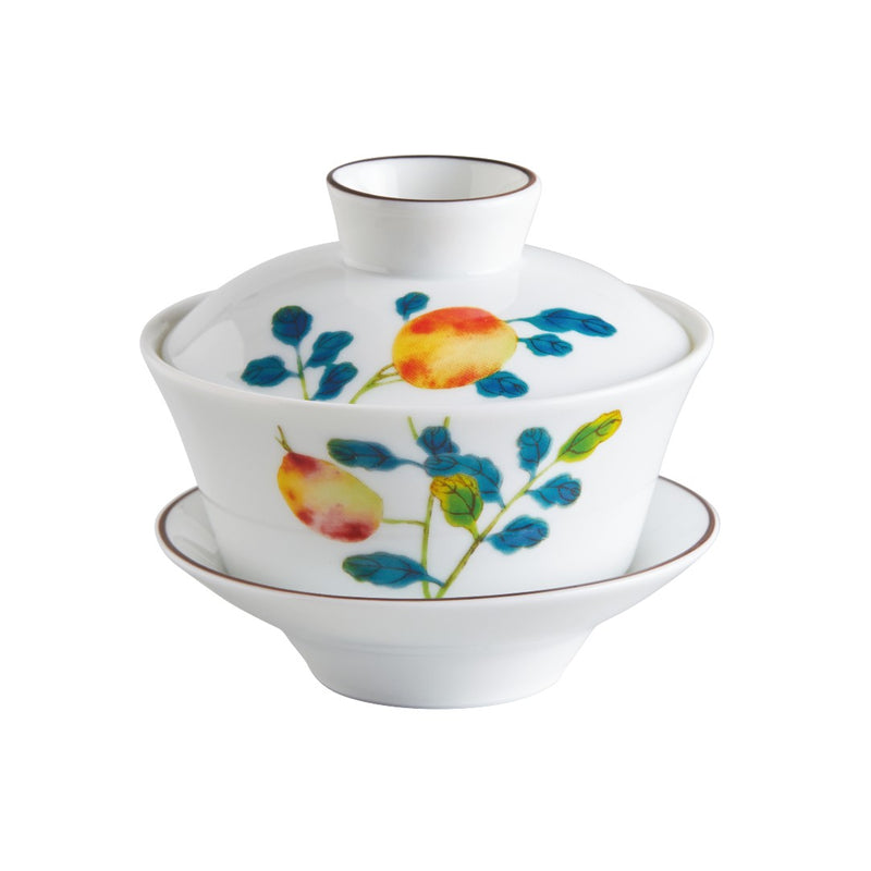 A Raynaud 'Harmonia' porcelain chinese tea set with a cup, lid, and saucer featuring colorful floral patterns.