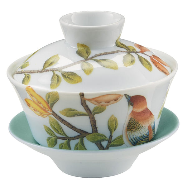asian tea set with white and turquoise base and floral design
