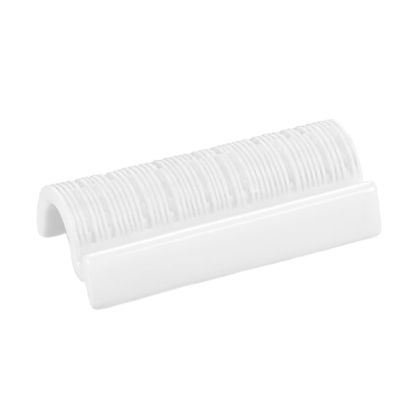 A white porcelain chopsticks holder with a counter-relief engraving pattern.